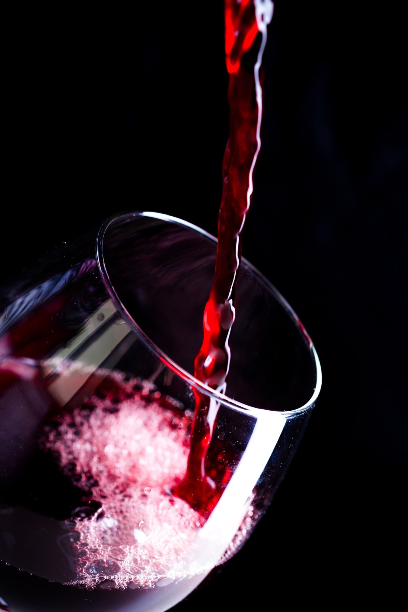 pouring-red-wine-into-glass-min CHÂTEAU TAYAC